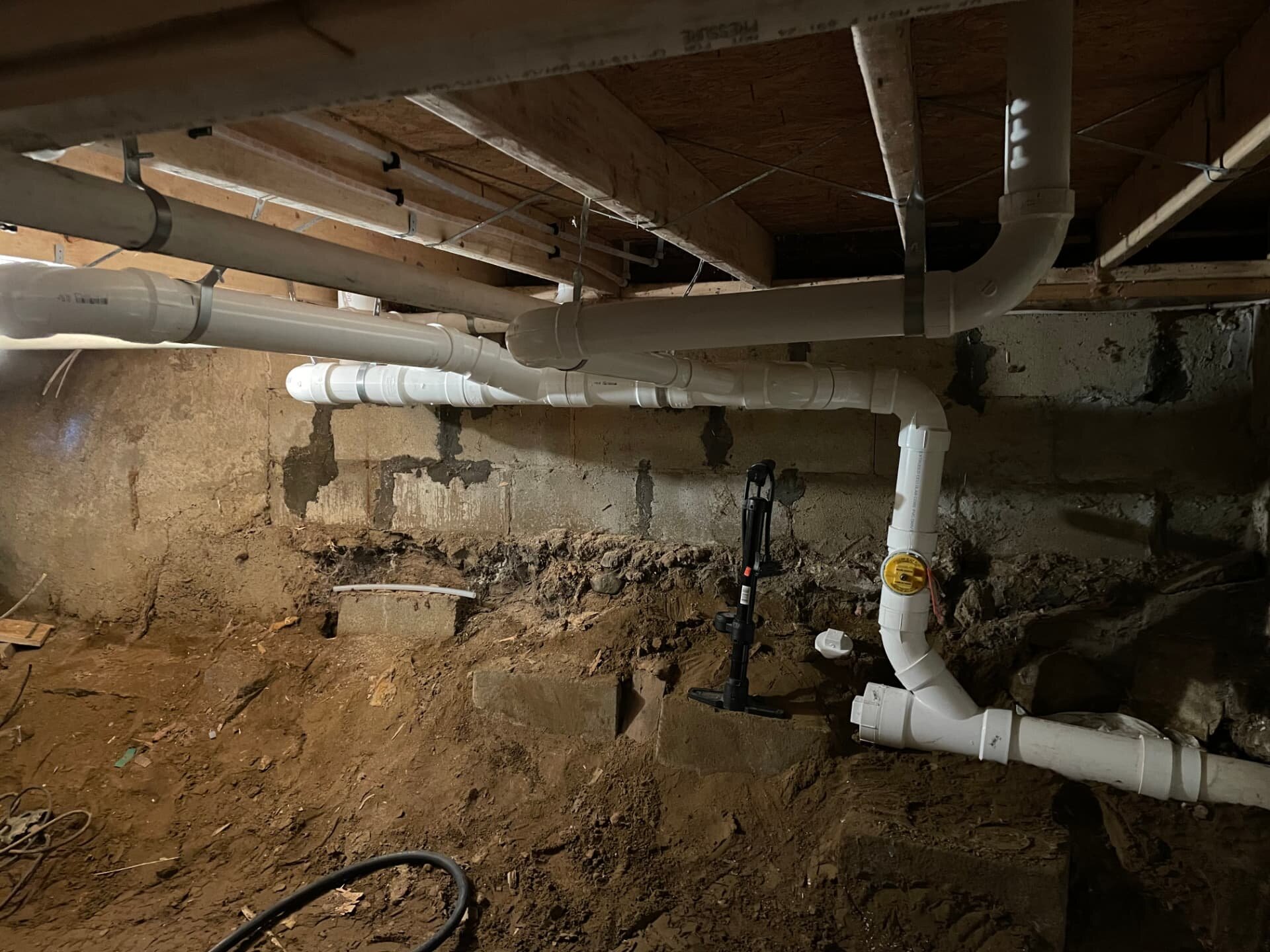 Drainage repipe in a basement in Tyngsborough, MA by Top Shelf Plumbing & Heating